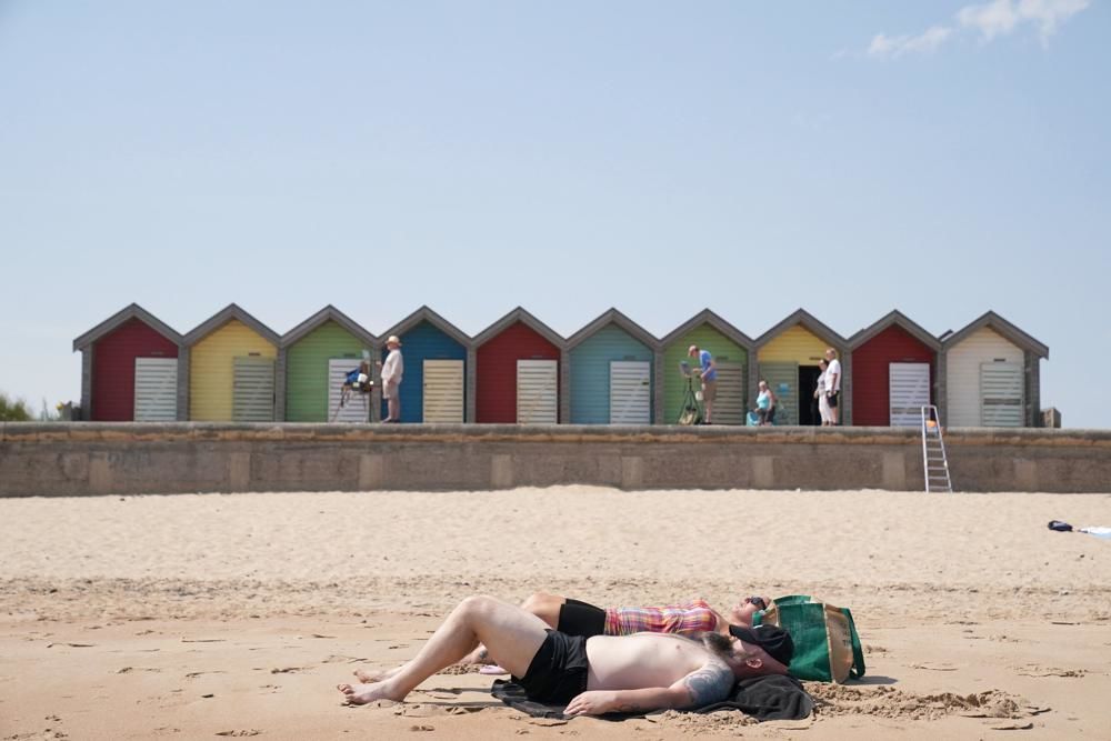 Millions swelter as UK endures its 1st extreme heat warning