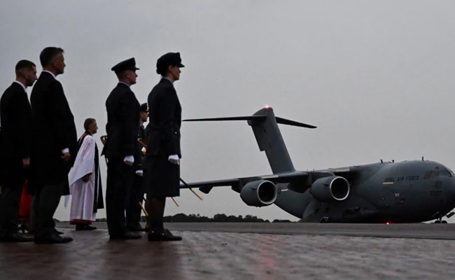 Plane Carrying Queen Elizabeth's Coffin Arrives In London