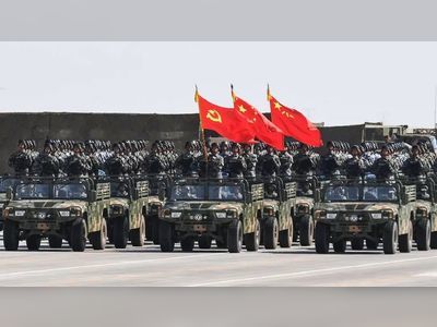 China boosts military budget while warning of escalating threats